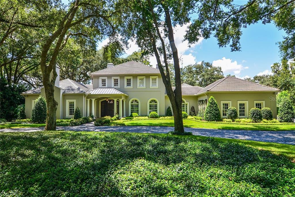 16306 Avila Boulevard Tampa, FL 33613 - Photo 1 of 1 a front view of a house with a yard