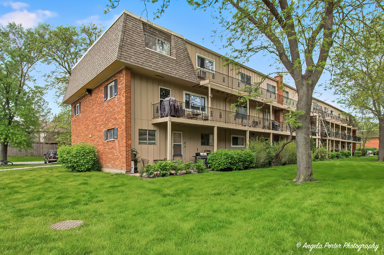2504 West Algonquin Road, Unit 3 Rolling Meadows, IL 60008 - Photo 18 of 23 a front view of a house with a yard