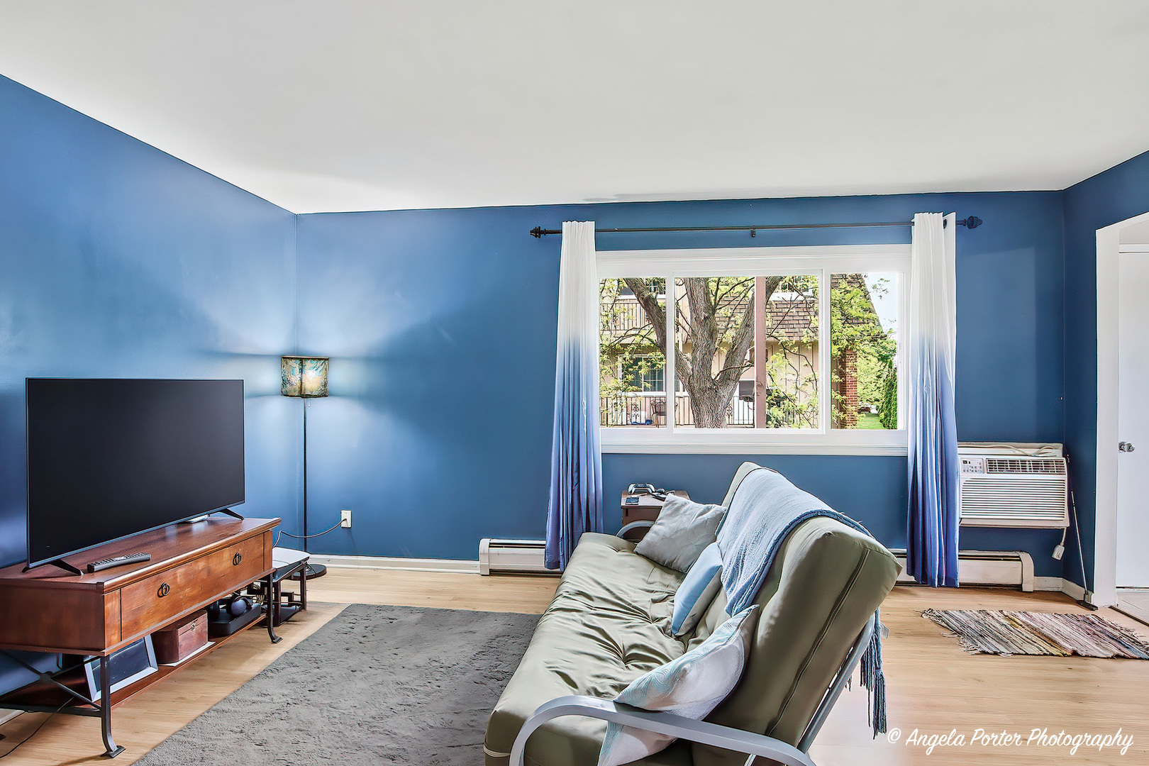 2504 West Algonquin Road, Unit 3 Rolling Meadows, IL 60008 - Photo 3 of 23 a bedroom with a bed and a flat screen tv