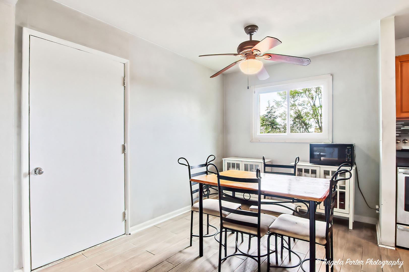 2504 West Algonquin Road, Unit 3 Rolling Meadows, IL 60008 - Photo 6 of 23 a dining room with furniture a chandelier and a window