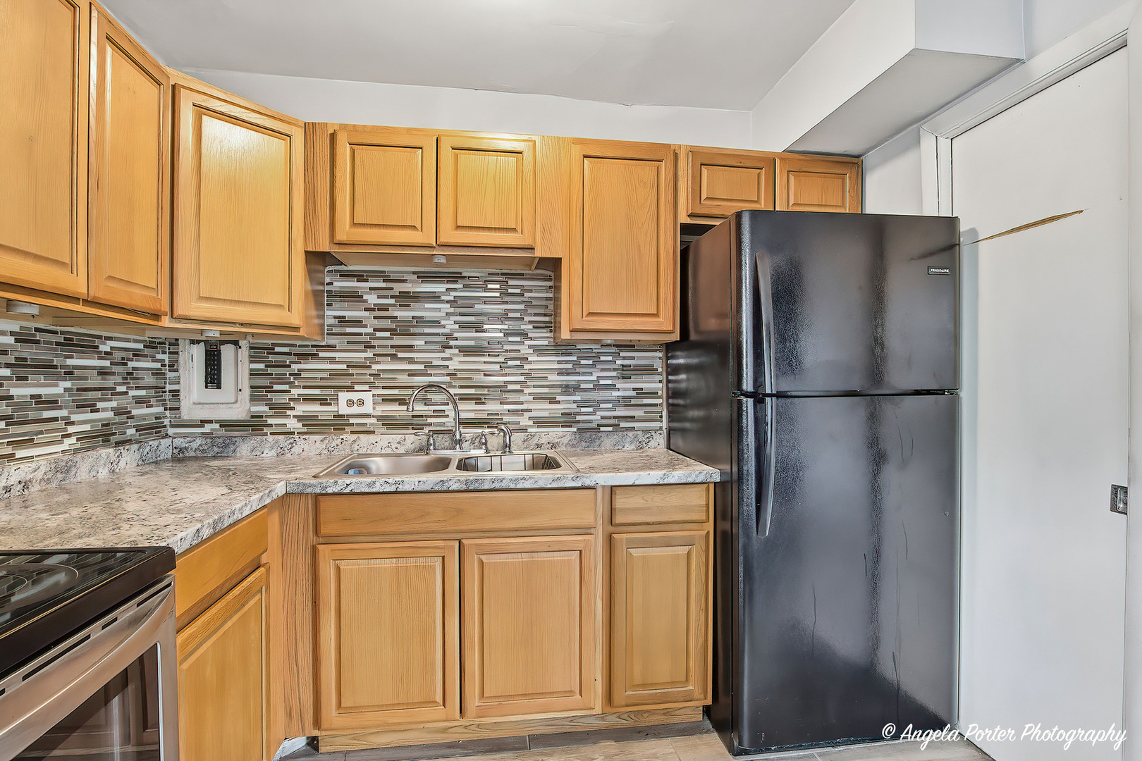 2504 West Algonquin Road, Unit 3 Rolling Meadows, IL 60008 - Photo 9 of 23 a kitchen with stainless steel appliances granite countertop a refrigerator and a sink