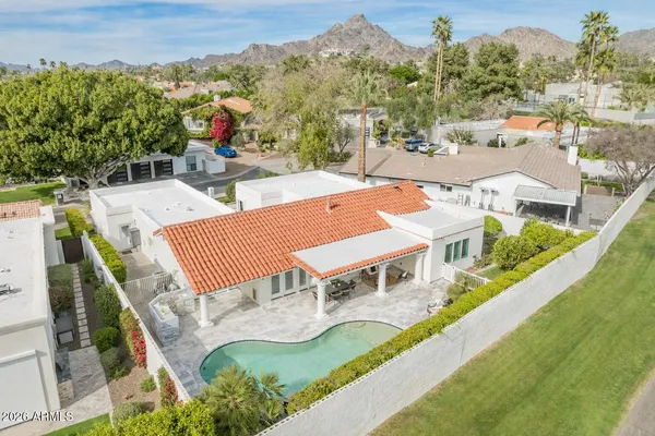 a living room with fireplace furniture and a flat screen tv