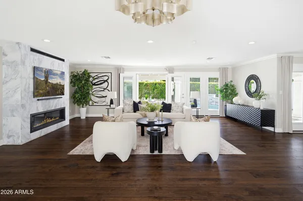 a view of a house with a backyard patio and swimming pool