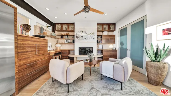 a kitchen with a table chairs stainless steel appliances and cabinets