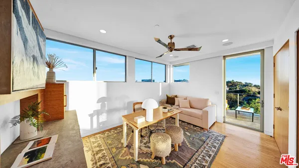 a living room with a couch and a flat screen tv