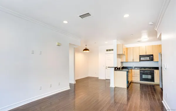 a view of kitchen with wooden floor