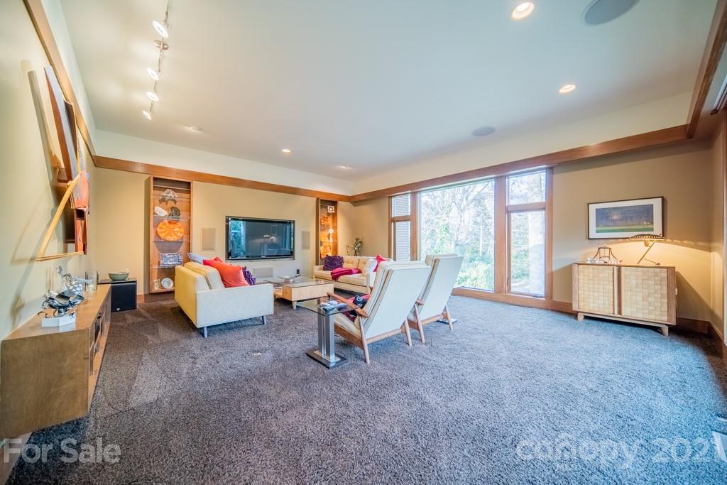 2827 Rothwood Drive Charlotte, NC 28211 - Photo 12 of 30 a living room with furniture and a flat screen tv