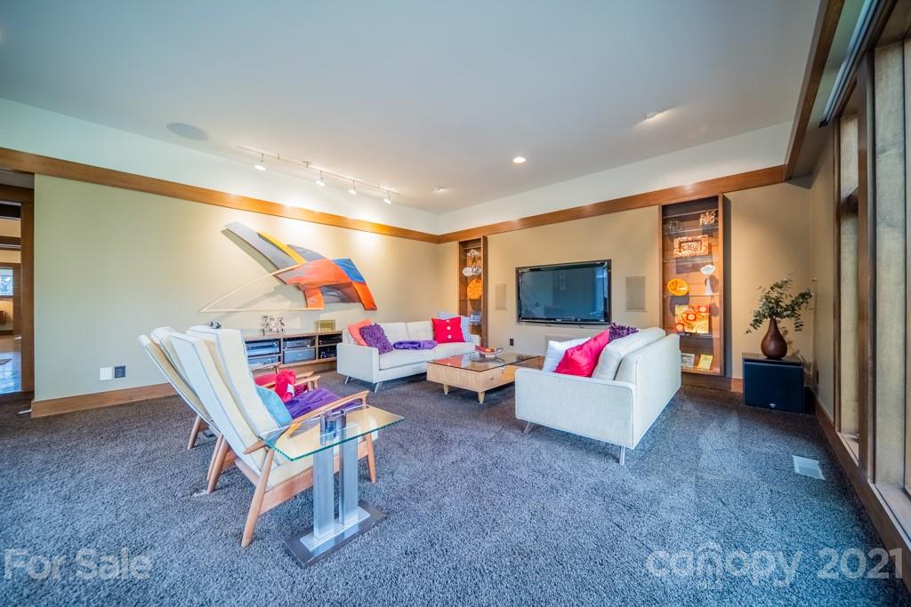 2827 Rothwood Drive Charlotte, NC 28211 - Photo 13 of 30 a living room with furniture and a flat screen tv