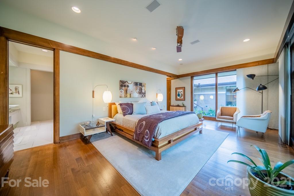 2827 Rothwood Drive Charlotte, NC 28211 - Photo 15 of 30 a spacious bedroom with a large bed and a couch
