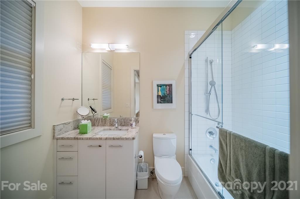 2827 Rothwood Drive Charlotte, NC 28211 - Photo 20 of 30 a bathroom with a granite countertop sink toilet and shower