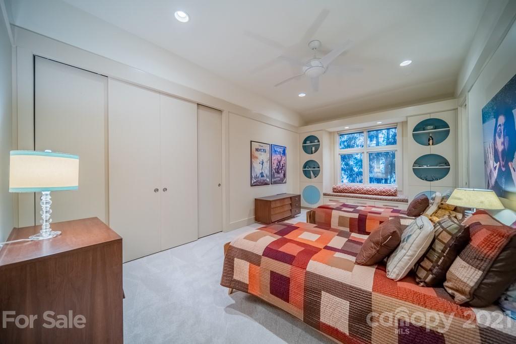 2827 Rothwood Drive Charlotte, NC 28211 - Photo 21 of 30 a bedroom with a bed and a dresser in it
