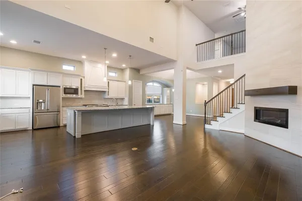a view of kitchen with cabinets and wooden floor
