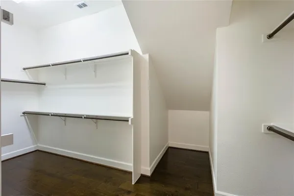 a view of an empty walk in closet