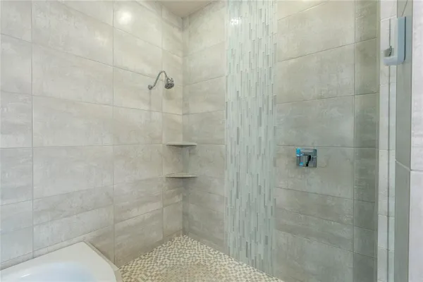 a spacious bathroom with a double vanity sink and mirror