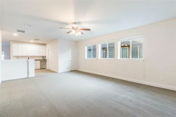 a kitchen with a sink cabinets and window