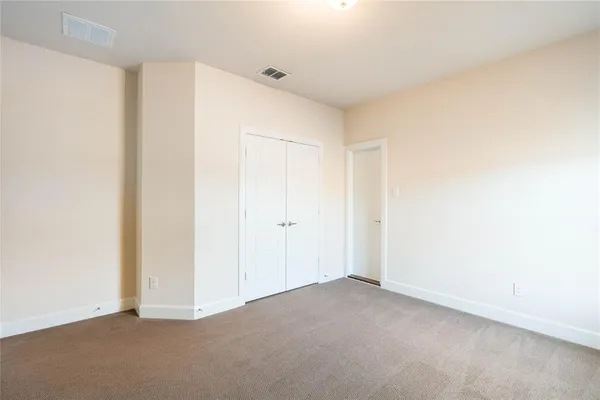 a view of an empty room with a fireplace
