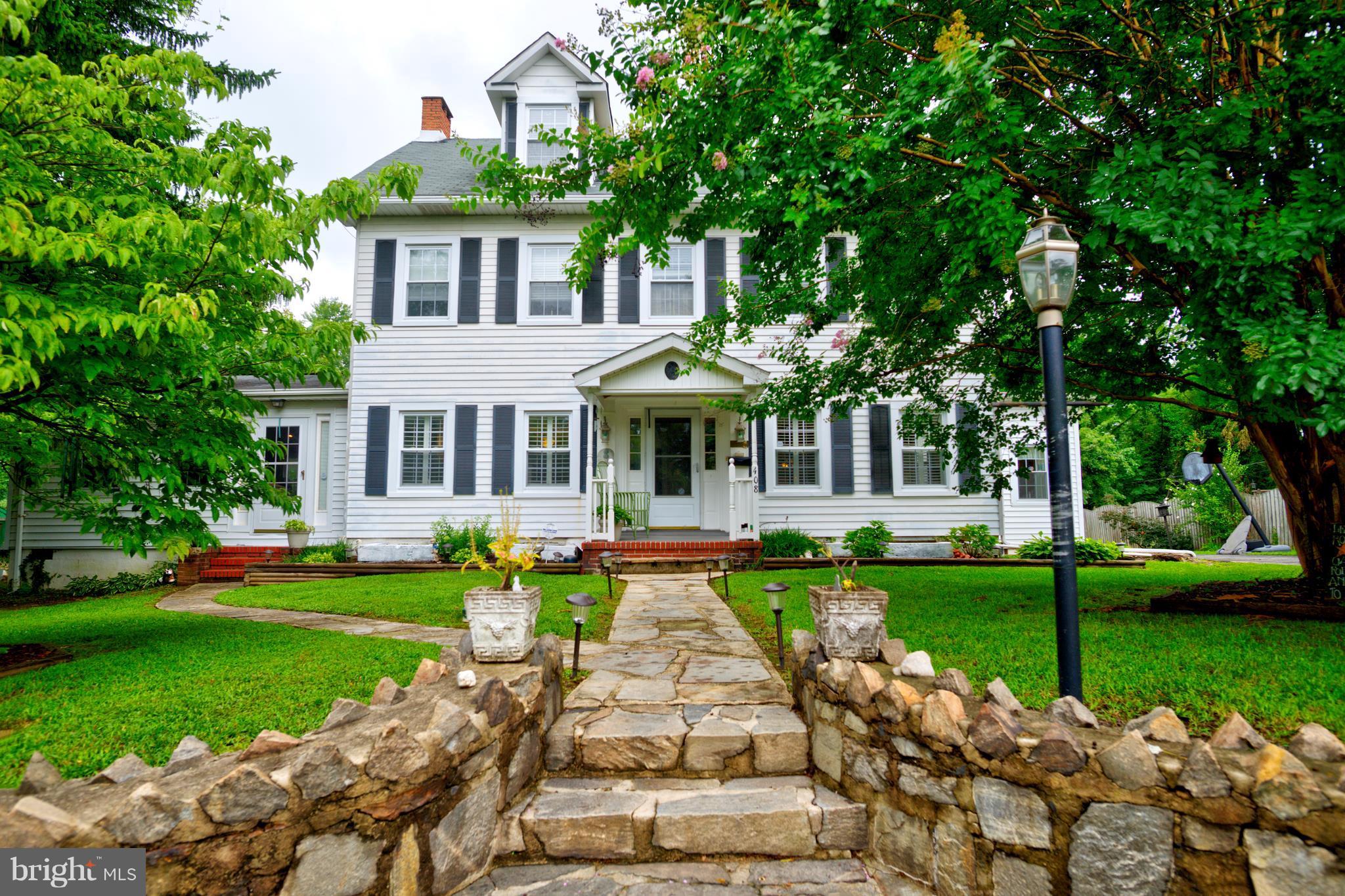 408 Hawthorne Road Linthicum Heights, MD 21090 - Photo 1 of 25 a front view of a house with garden and porch