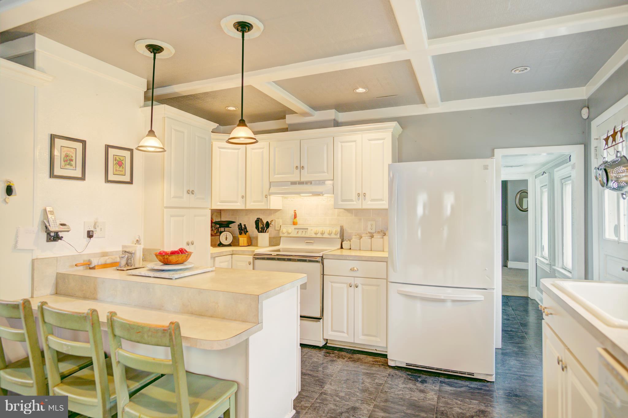 408 Hawthorne Road Linthicum Heights, MD 21090 - Photo 13 of 25 a kitchen with appliances a sink and cabinets