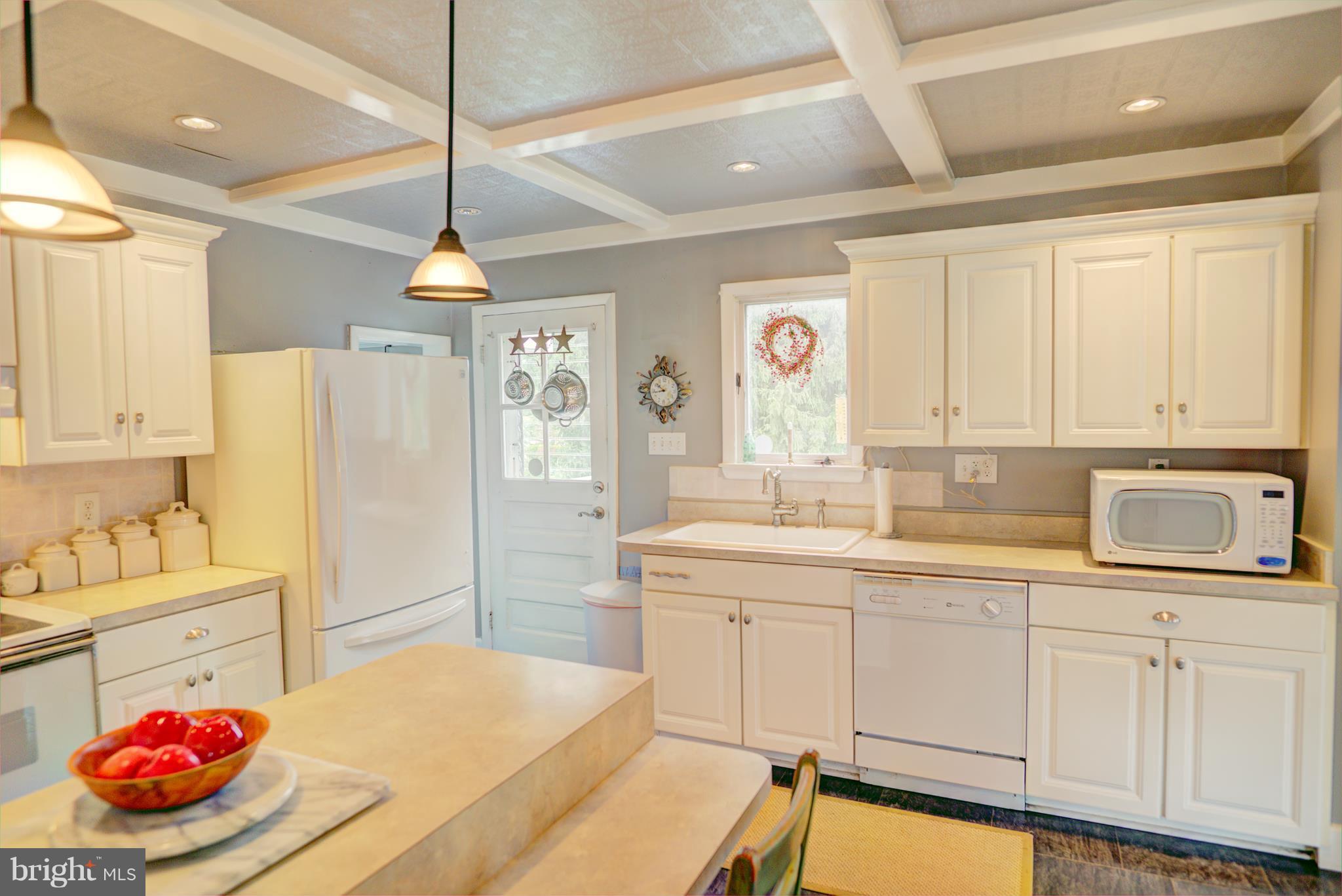 408 Hawthorne Road Linthicum Heights, MD 21090 - Photo 14 of 25 a kitchen with stainless steel appliances a stove a sink and a refrigerator