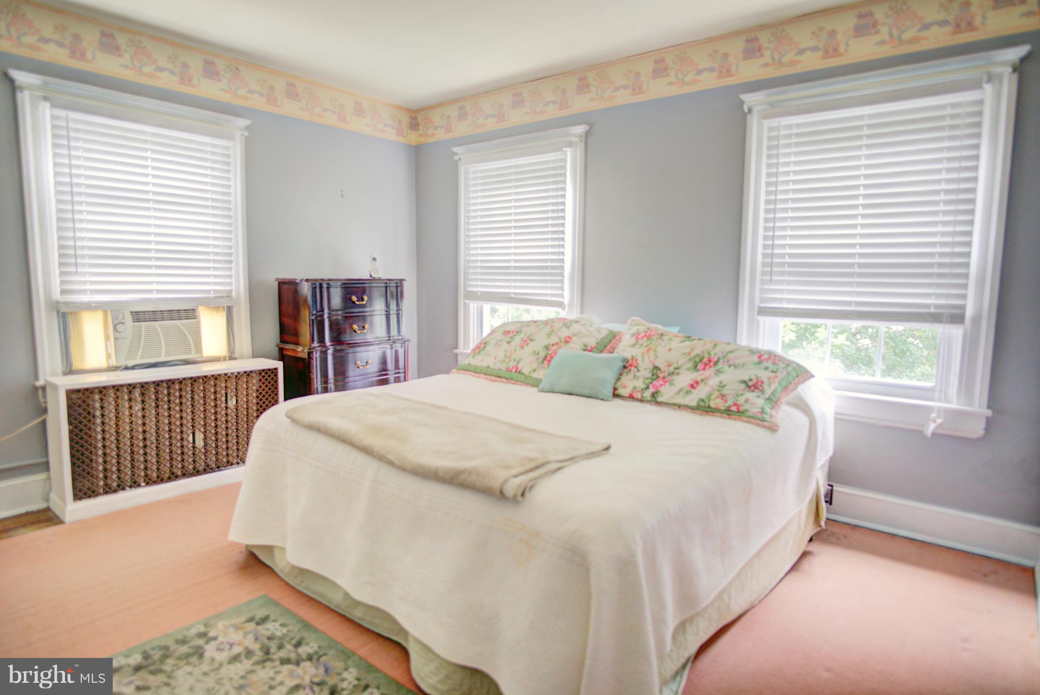 408 Hawthorne Road Linthicum Heights, MD 21090 - Photo 16 of 25 a large bed sitting in a bedroom next to a window
