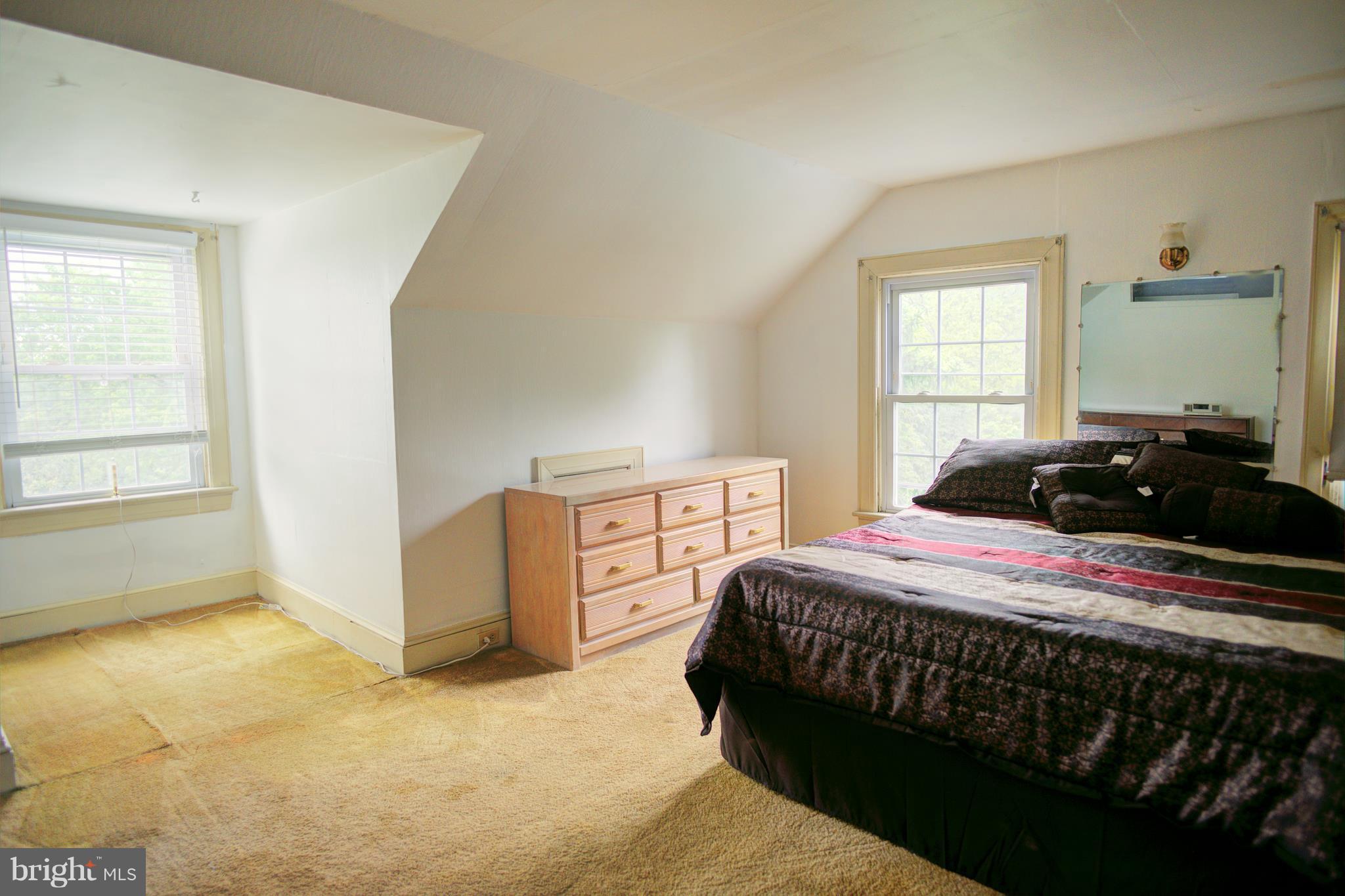 408 Hawthorne Road Linthicum Heights, MD 21090 - Photo 23 of 25 a bedroom with a bed and a window