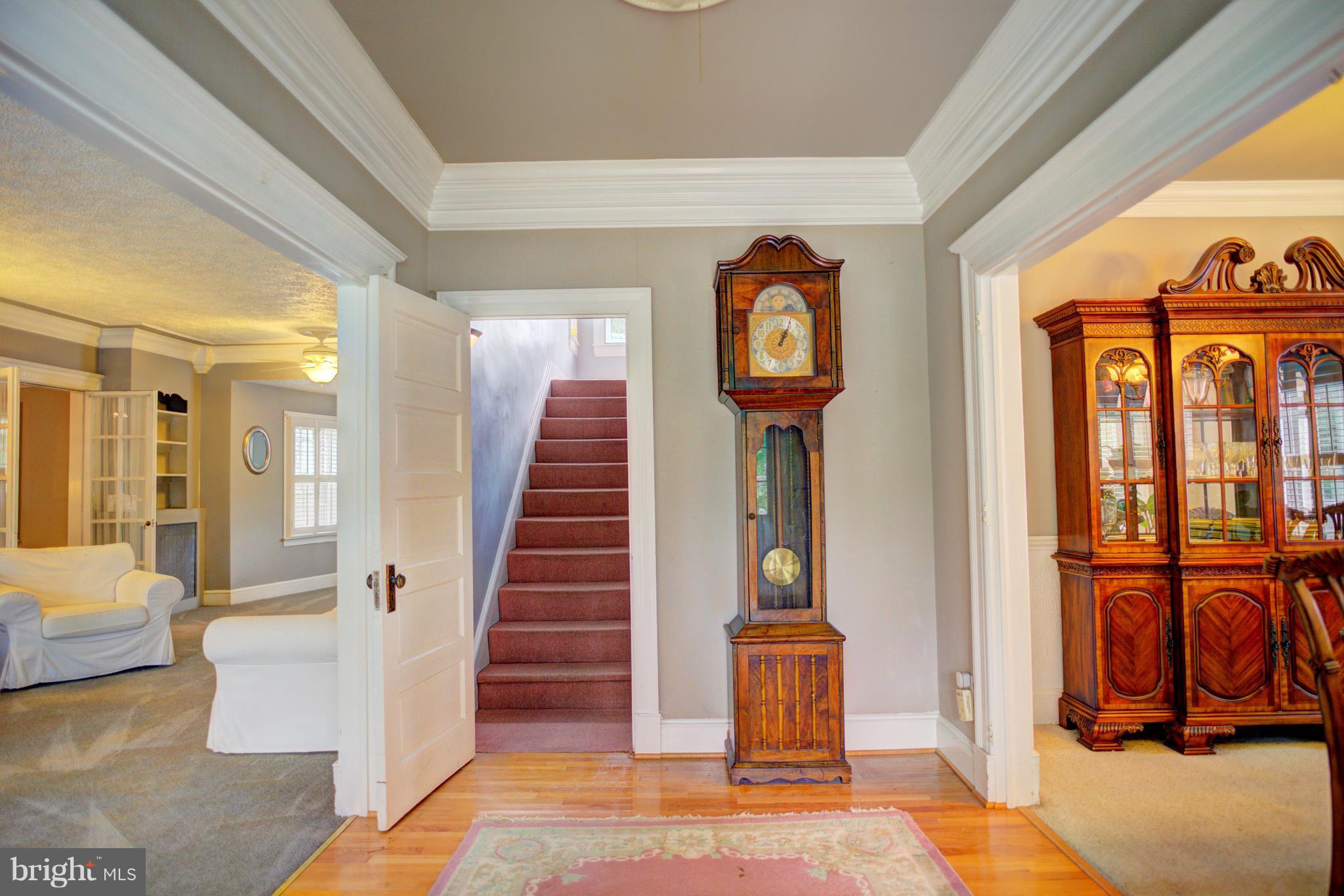 408 Hawthorne Road Linthicum Heights, MD 21090 - Photo 5 of 25 a view of a hallway with entryway wooden floor and front door