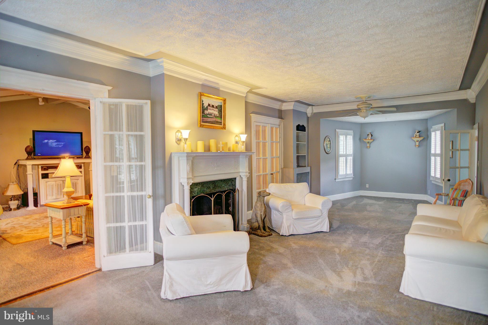 408 Hawthorne Road Linthicum Heights, MD 21090 - Photo 9 of 25 a living room with furniture and a fireplace