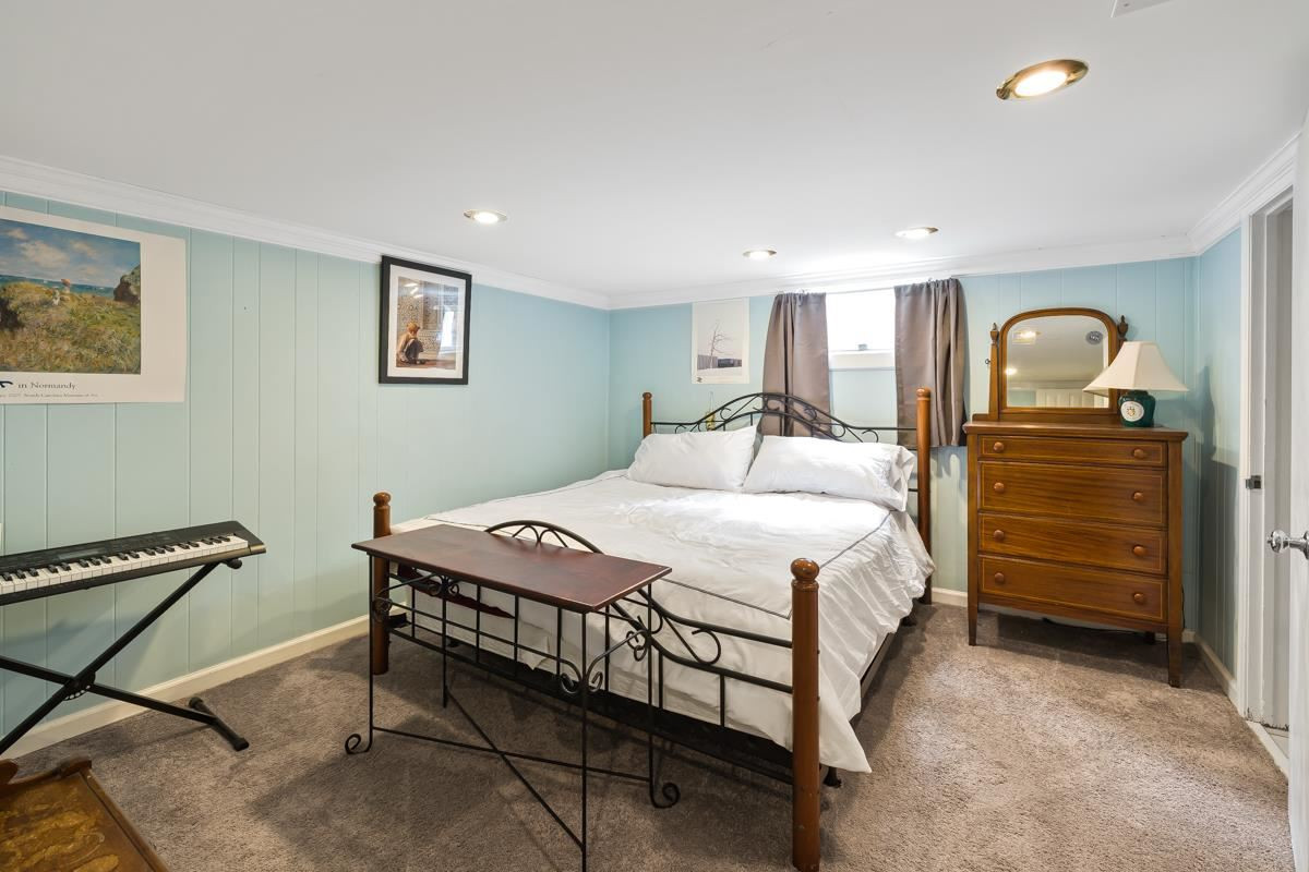 2506 Van Dyke Avenue Raleigh, NC 27607 - Photo 17 of 28 3rd bedroom in the basement with en-suite full bathroom. Bedroom