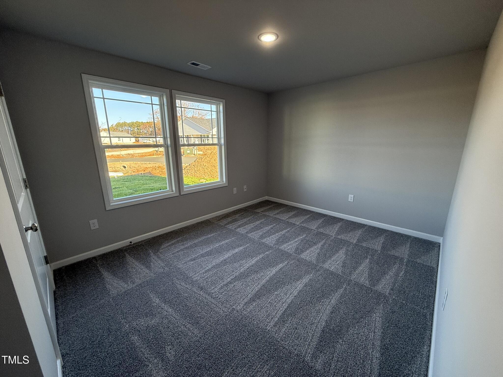 198 Pate Landing Drive Selma, NC 27576 - Photo 13 of 16 an empty room with a window