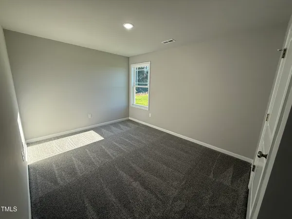 an empty room with window