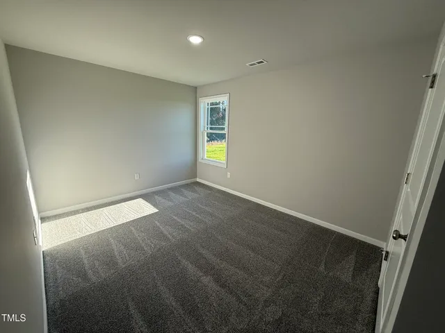 an empty room with window