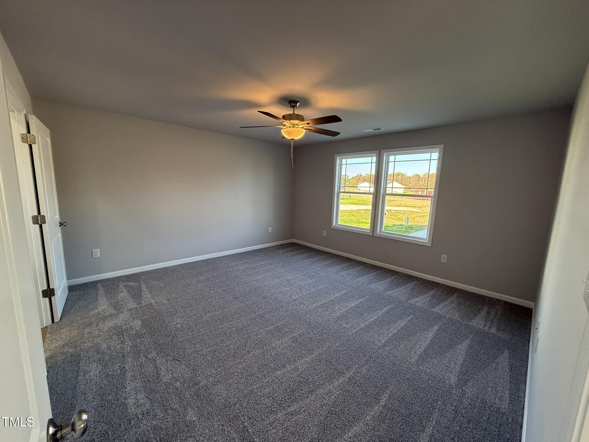 198 Pate Landing Drive Selma, NC 27576 - Photo 8 of 16 a view of an empty room with a window