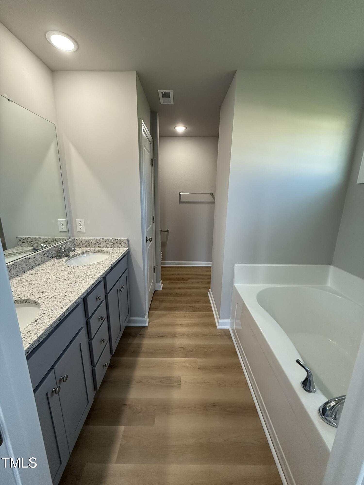 198 Pate Landing Drive Selma, NC 27576 - Photo 10 of 16 a bathroom with a tub sink and mirror
