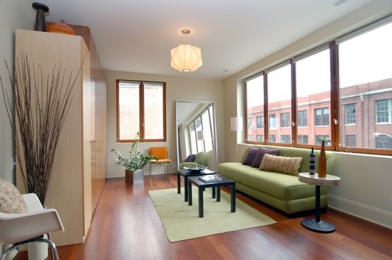 1152 West Fulton Street, Unit 3A Chicago, IL 60607 - Photo 8 of 8 a living room with furniture and a large window