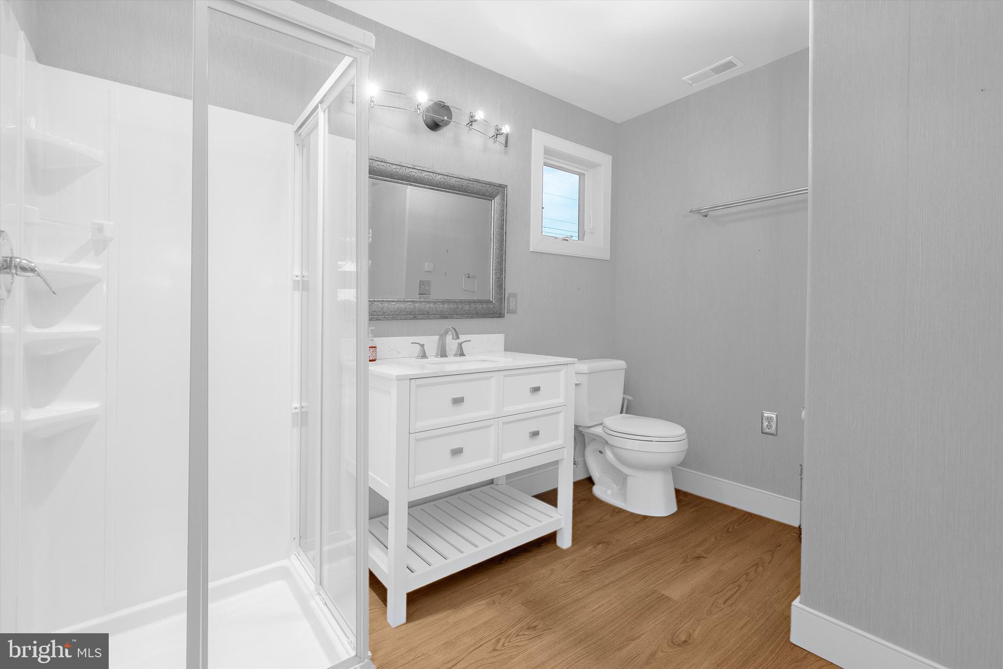 10761 Kasota Road Chestertown, MD 21620 - Photo 15 of 47 a bathroom with a toilet a sink and mirror