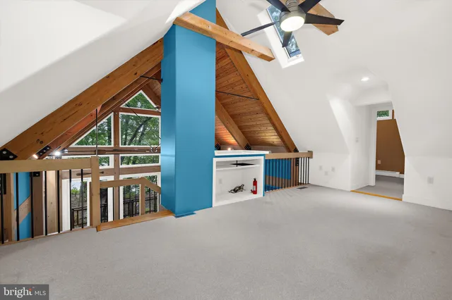 a view of a house with stairs and a ceiling fan