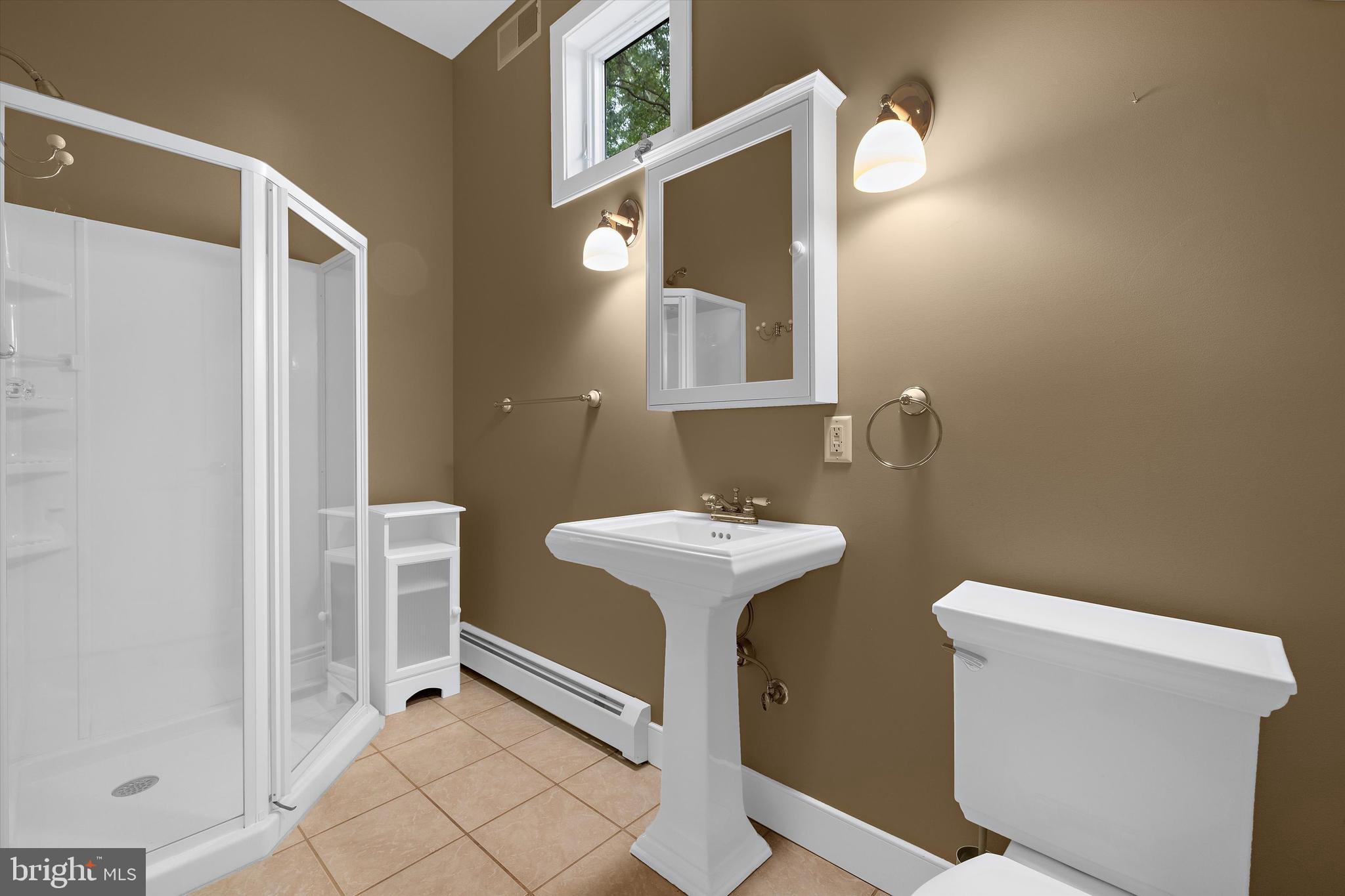 10761 Kasota Road Chestertown, MD 21620 - Photo 21 of 47 a bathroom with a sink a toilet and a mirror