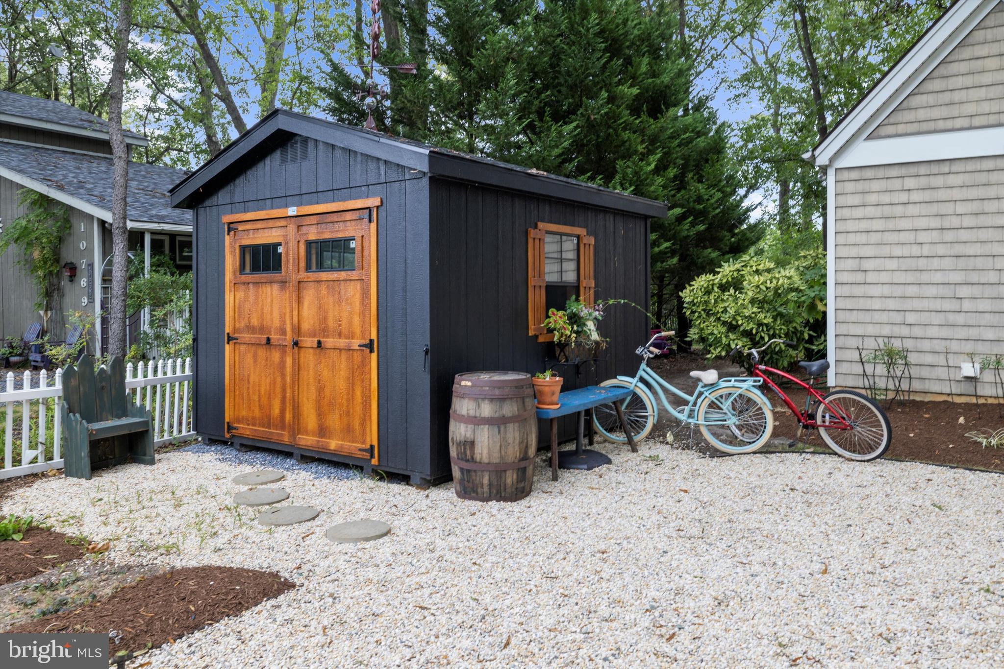 10761 Kasota Road Chestertown, MD 21620 - Photo 32 of 47 a view of a house with a patio and a yard