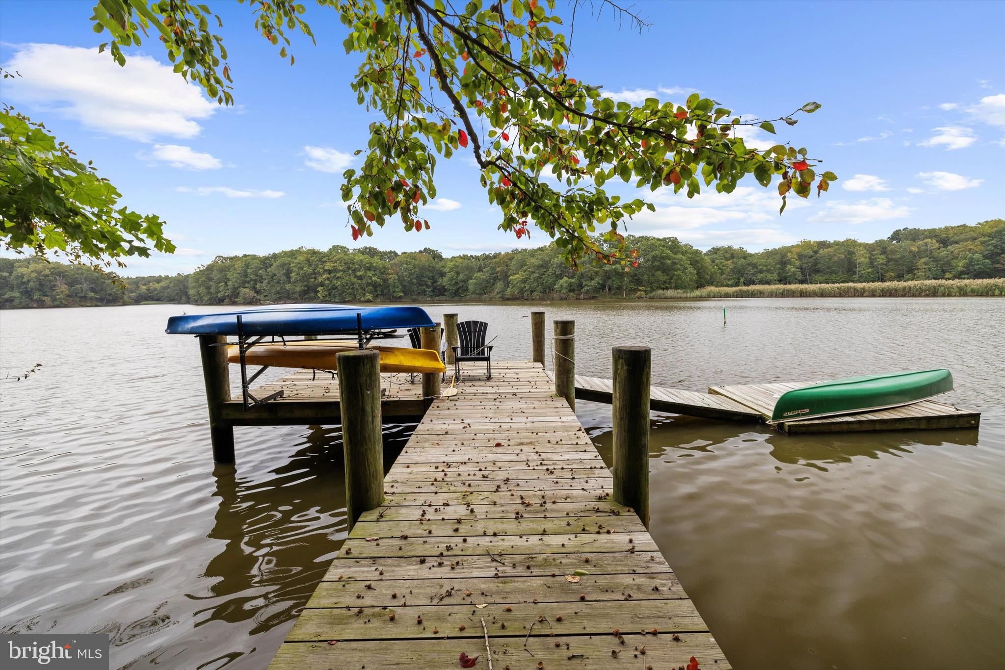 10761 Kasota Road Chestertown, MD 21620 - Photo 36 of 47 a view of a lake with table and chairs