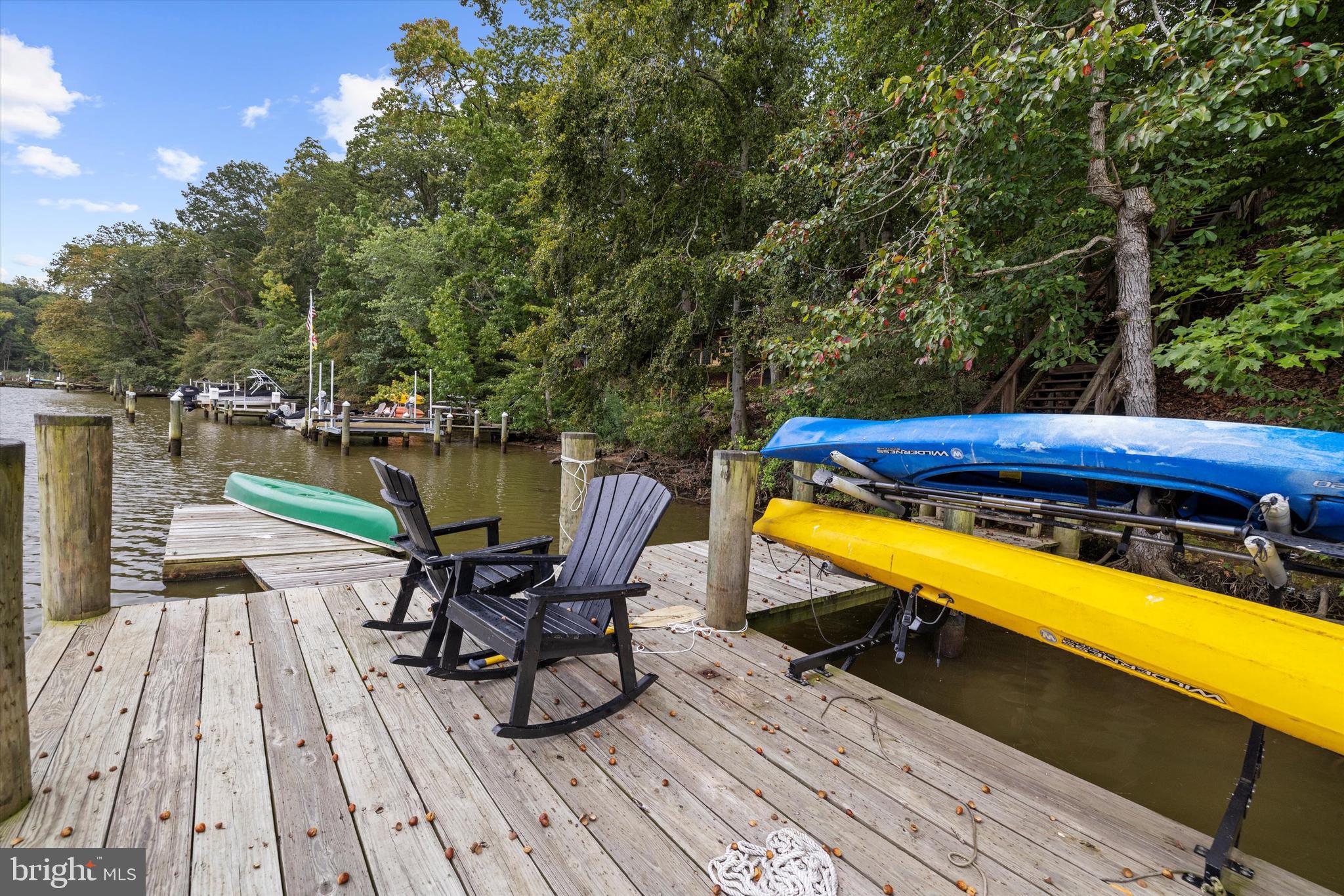 10761 Kasota Road Chestertown, MD 21620 - Photo 37 of 47 a view of a chairs and table on the deck with wooden floor and swimming pool