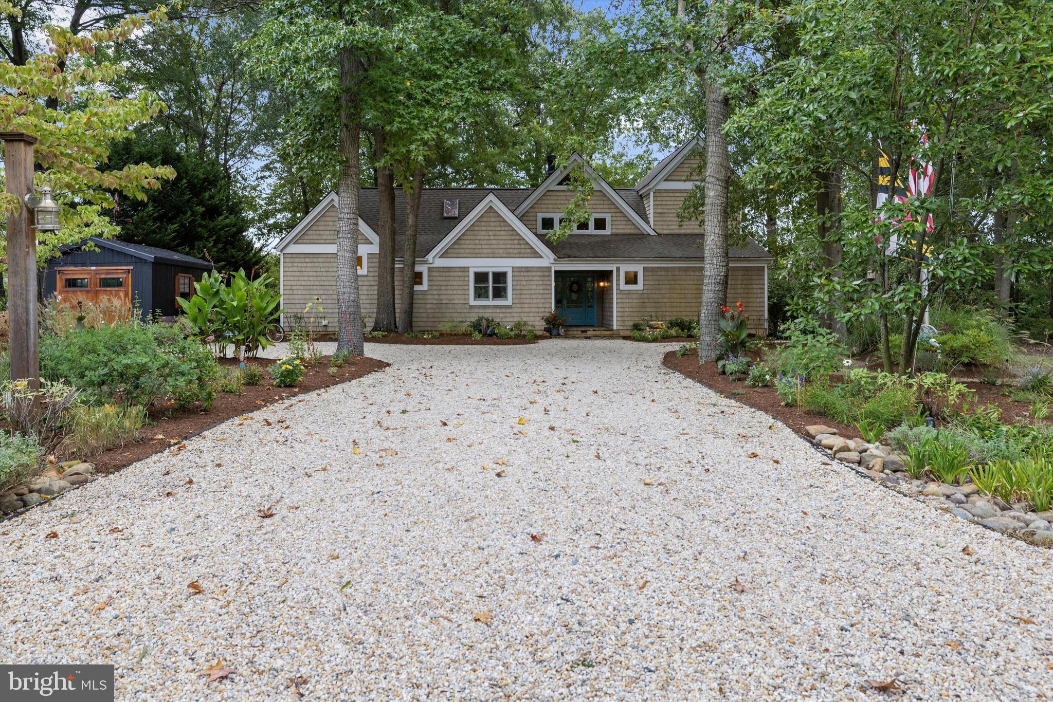 10761 Kasota Road Chestertown, MD 21620 - Photo 5 of 47 a front view of a house with a yard and garage