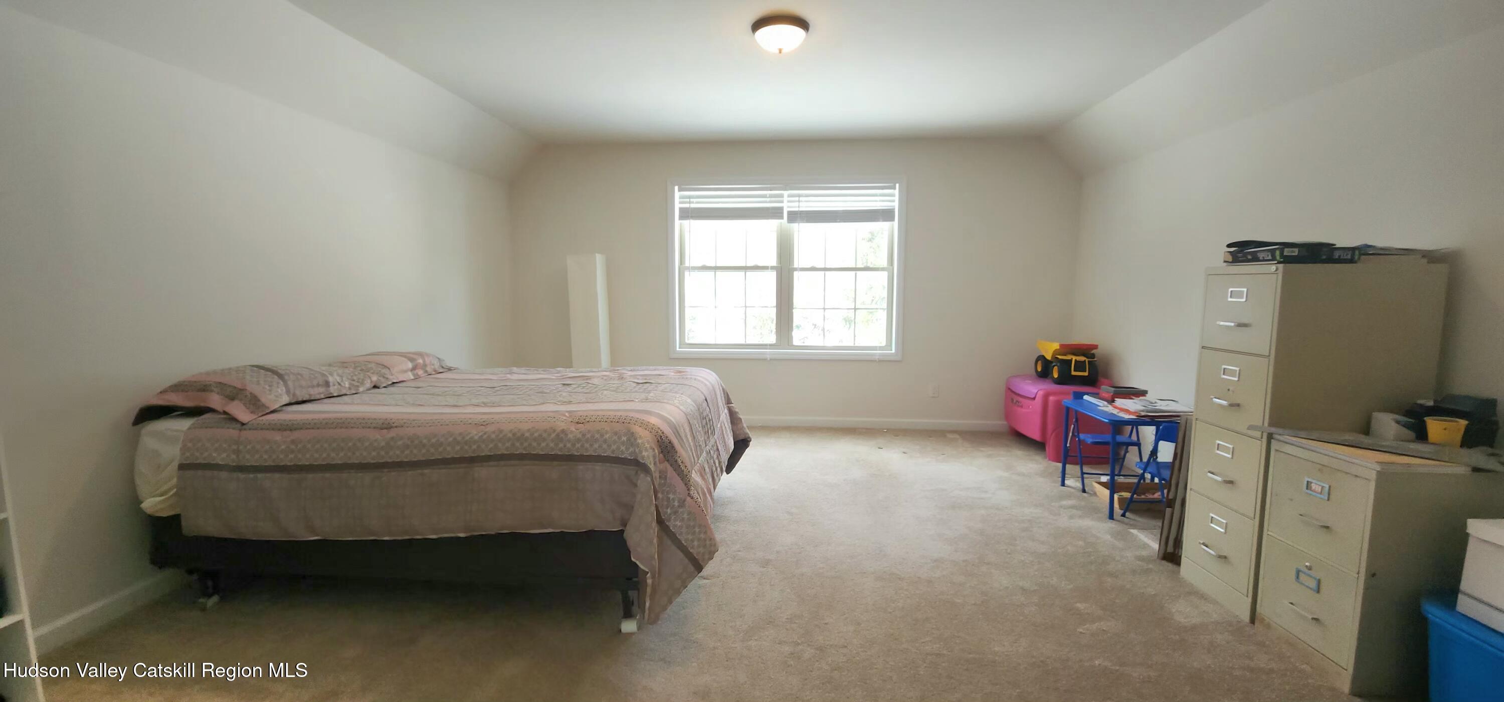 89 Zinno Road Ashland, NY 12496 - Photo 20 of 41 a bedroom with a bed and a window