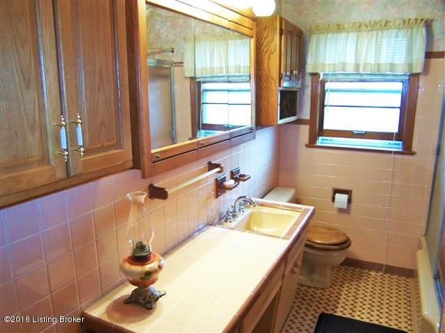 4604 Dover Road Louisville, KY 40216 - Photo 26 of 37 Full Bath with room for a his and her sink, linen closet, shower/tub unit, 2 medicine cabinets and over-the-toilet storage.