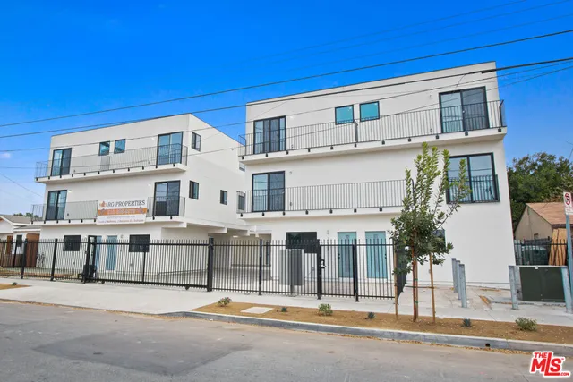 a view of a building with a street