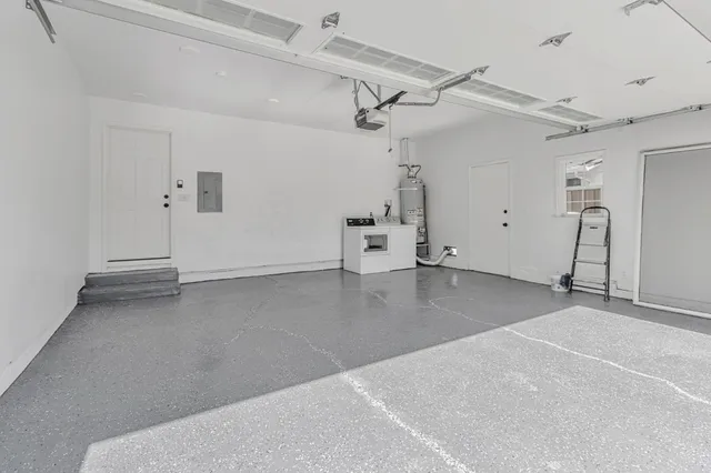 an empty room with entrance and windows