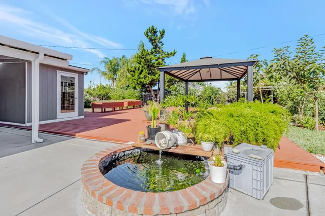 a view of a swimming pool with a patio