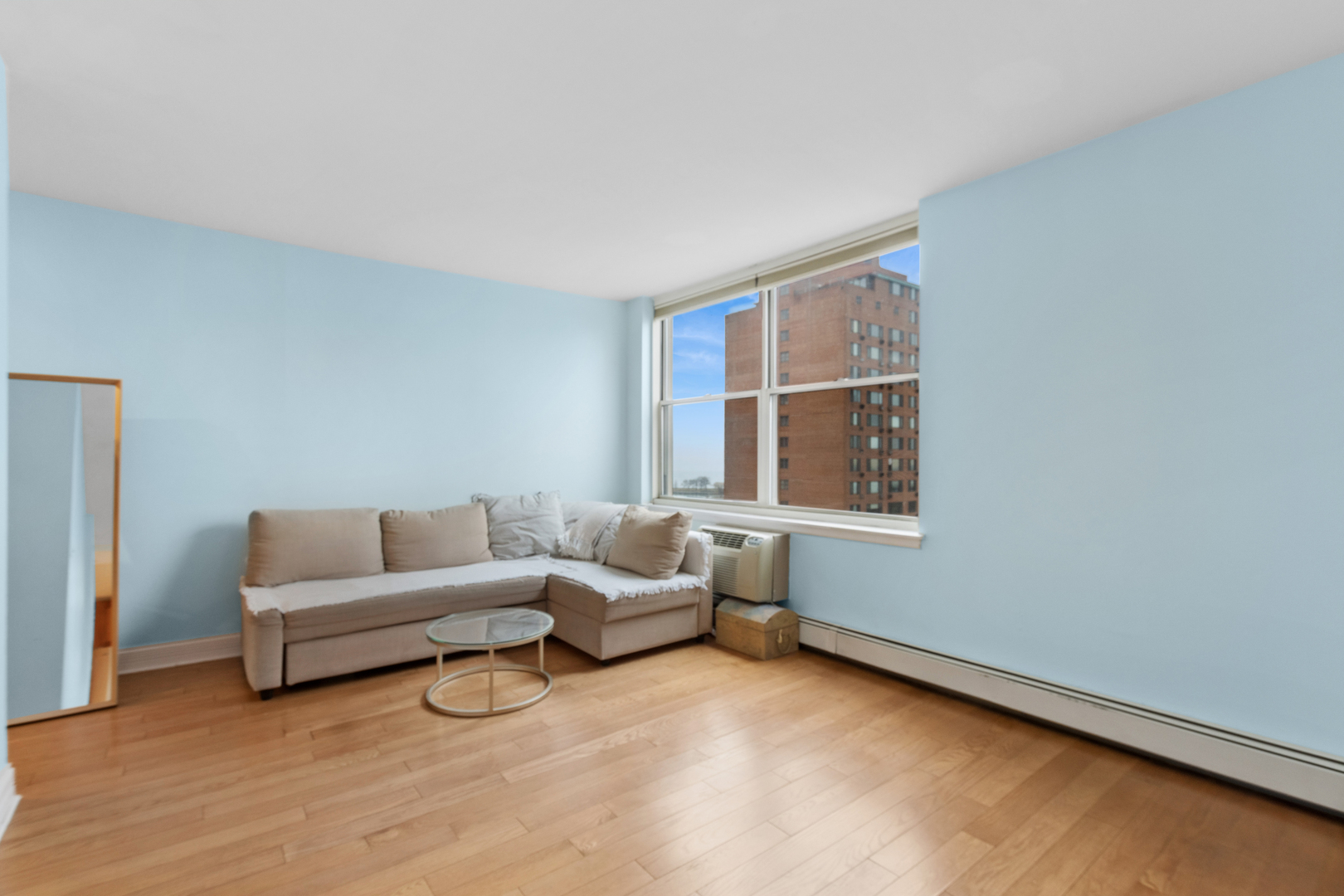 3033 North Sheridan Road, Unit 1502 Chicago, IL 60657 - Photo 3 of 19 a living room with furniture and a window