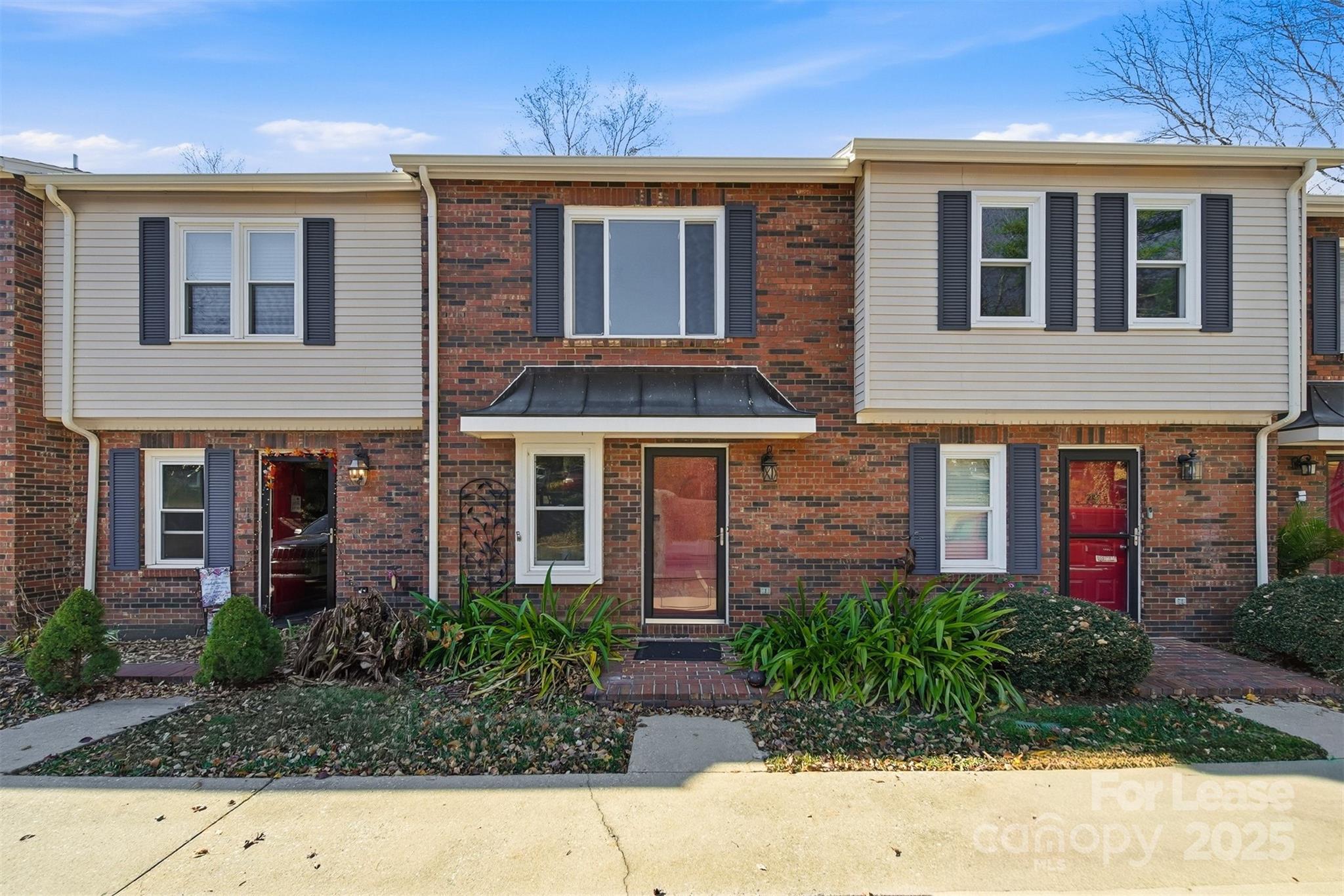 2705 North Center Street, Unit 78 Hickory, NC 28601 - Photo 2 of 17 a front view of a house having yard