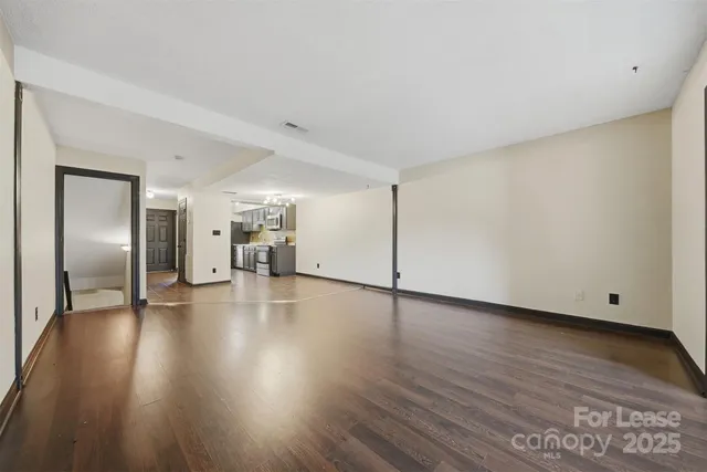 a view of a livingroom with wooden floor