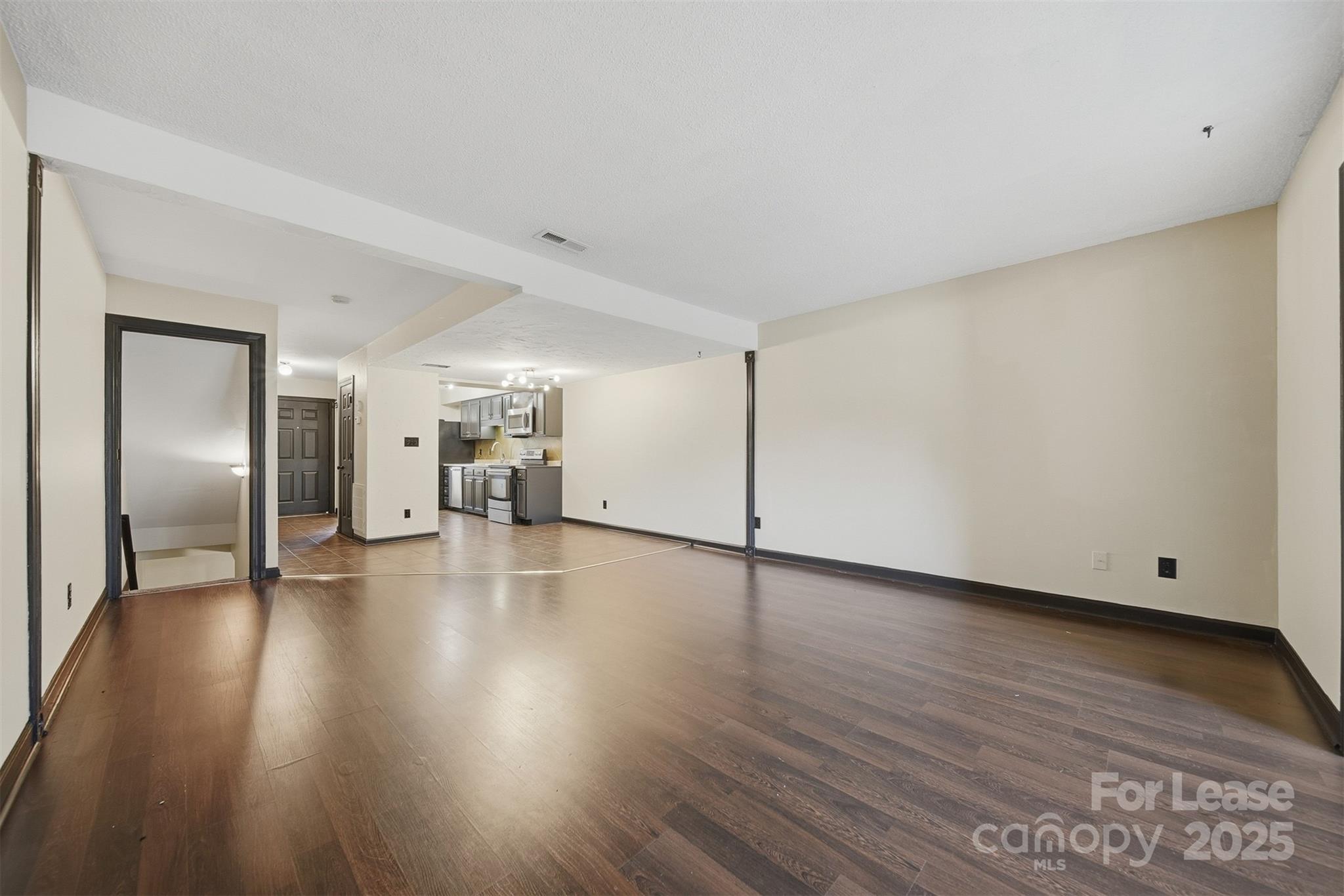 2705 North Center Street, Unit 78 Hickory, NC 28601 - Photo 3 of 17 a view of a livingroom with wooden floor